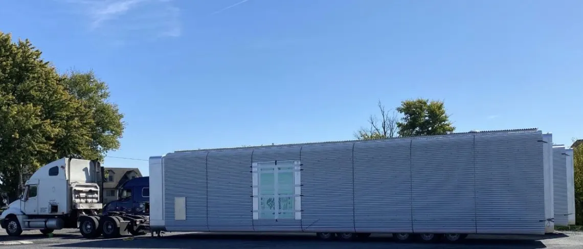 Side view of a Skyward Command Pod with corrugated aluminum siding