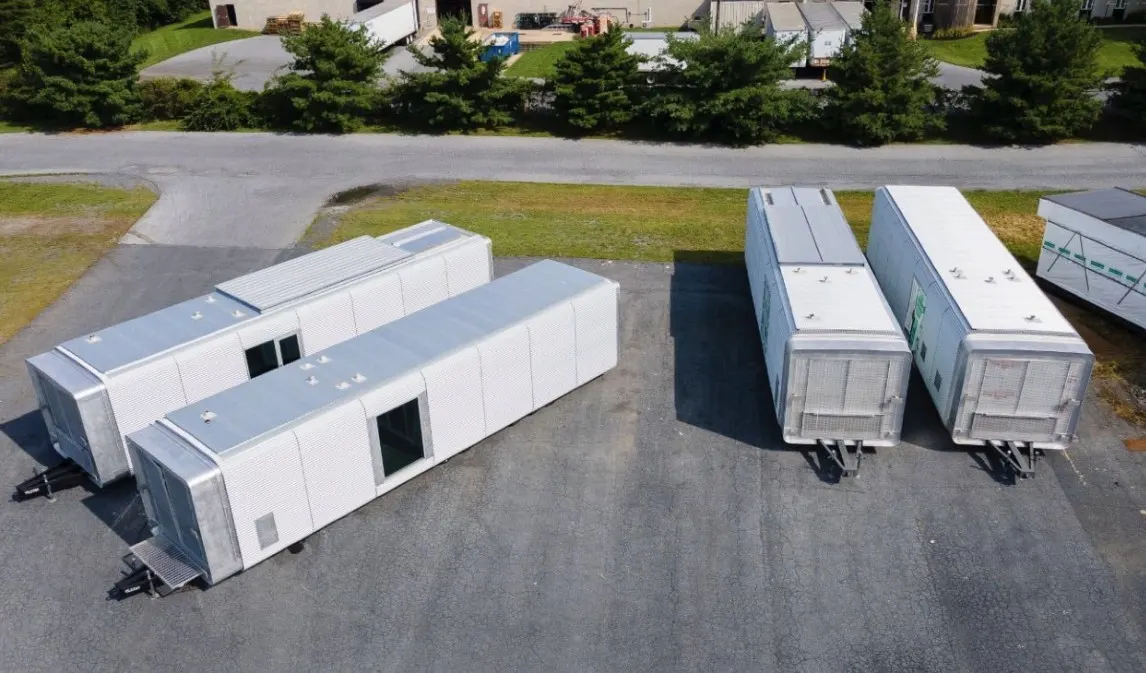 Aerial view of command pods on a paved lot