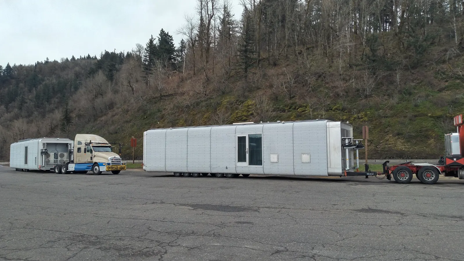Command pods loaded on trucks for transport along a highway
